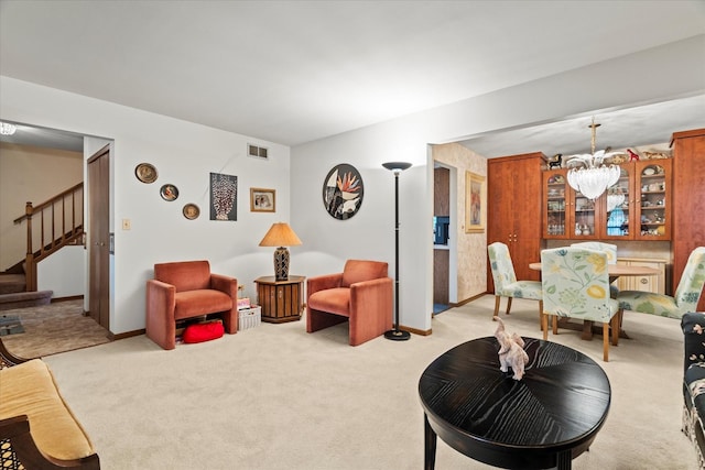 620 W 58th St, Westmont, IL 60559 - living room featuring light colored carpet, stairway, a chandelier, and baseboards