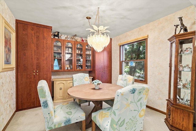 620 W 58th St, Westmont, IL 60559 - dining room with light colored carpet, baseboards, and a chandelier