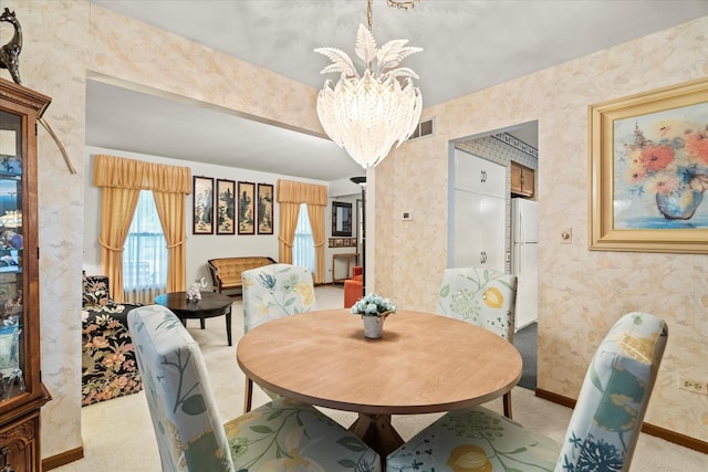 620 W 58th St, Westmont, IL 60559 - dining space with a chandelier, light colored carpet, baseboards, and wallpapered walls