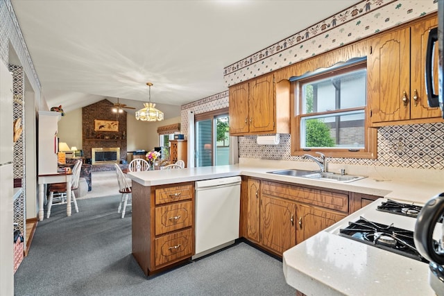620 W 58th St, Westmont, IL 60559 - kitchen with dishwasher, a sink, a peninsula, open floor plan, and light countertops