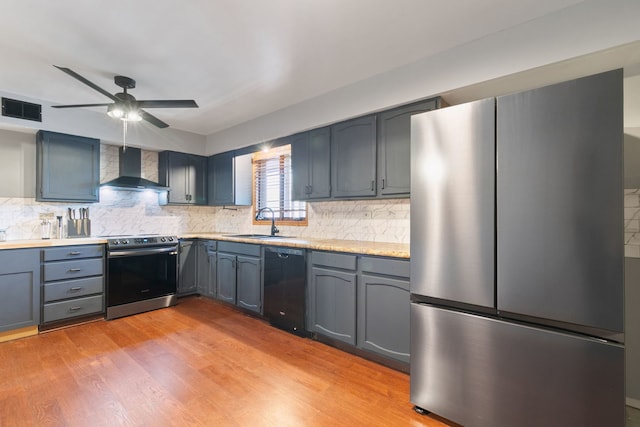 11015 S Theresa Cir Unit 3C, Palos Hills, IL 60465 - kitchen featuring appliances with stainless steel finishes, wall chimney exhaust hood, backsplash, light countertops, and light wood-type flooring