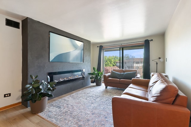 11015 S Theresa Cir Unit 3C, Palos Hills, IL 60465 - living area with wood finished floors and a glass covered fireplace