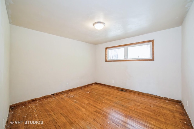 880 Marcella Rd, Merrillville, IN 46410 - unfurnished room featuring wood-type flooring and baseboards
