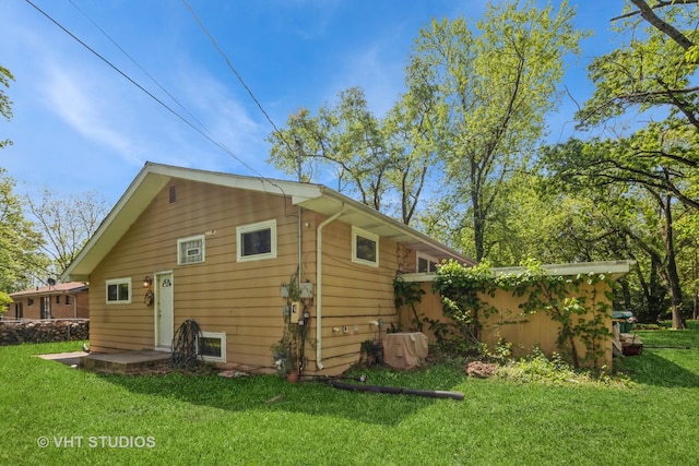 880 Marcella Rd, Merrillville, IN 46410 - rear view of property with a lawn