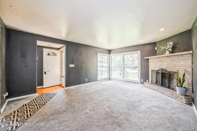 880 Marcella Rd, Merrillville, IN 46410 - unfurnished living room with carpet flooring, baseboards, a brick fireplace, and recessed lighting
