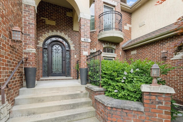 4111 Douglas Rd, Downers Grove, IL 60515 - view of exterior entry with brick siding and a balcony