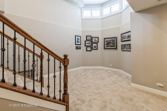 4111 Douglas Rd, Downers Grove, IL 60515 - staircase with carpet floors, baseboards, and a towering ceiling