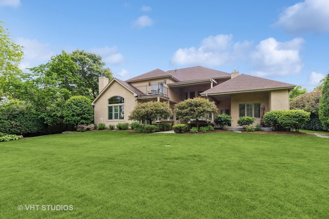 4111 Douglas Rd, Downers Grove, IL 60515 - view of front of home with a chimney, a front lawn, and stucco siding