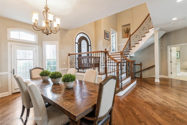 4111 Douglas Rd, Downers Grove, IL 60515 - dining area with wood finished floors, stairs, a chandelier, baseboards, and recessed lighting