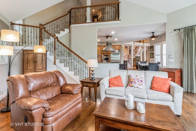 4111 Douglas Rd, Downers Grove, IL 60515 - living area featuring stairway, light wood-style floors, high vaulted ceiling, and ceiling fan