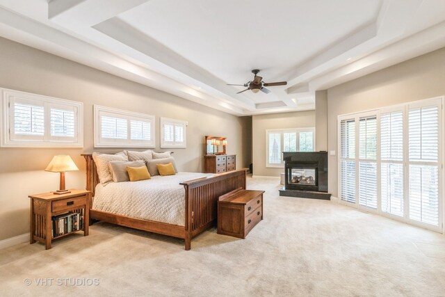 4111 Douglas Rd, Downers Grove, IL 60515 - carpeted bedroom featuring a raised ceiling, a multi sided fireplace, and ceiling fan