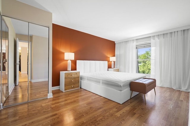 812 N River Rd Unit 3B, Mount Prospect, IL 60056 - bedroom featuring wood finished floors, baseboards, and a closet