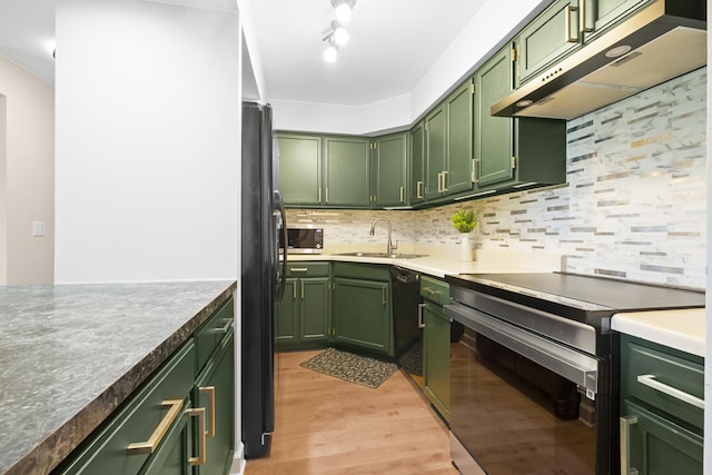 812 N River Rd Unit 3B, Mount Prospect, IL 60056 - kitchen with green cabinets, range with electric cooktop, under cabinet range hood, and a sink