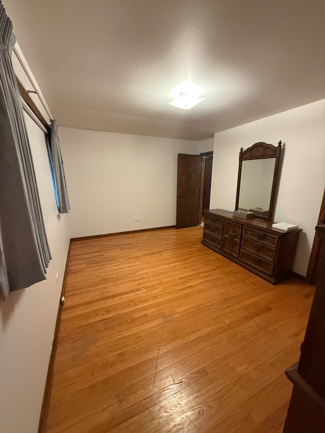 17121 Bernadine St, Lansing, IL 60438 - unfurnished bedroom with light wood-style flooring