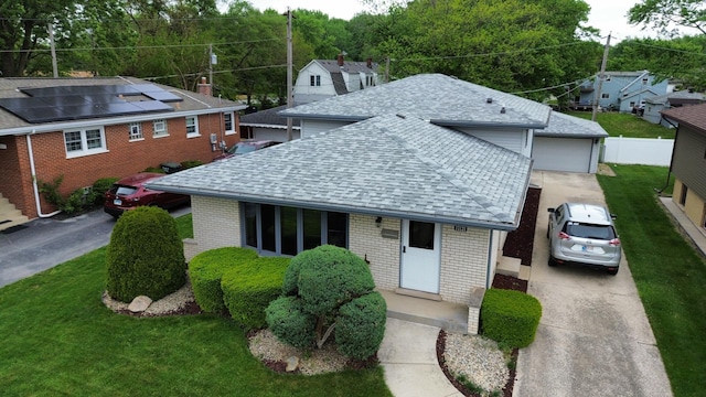 17121 Bernadine St, Lansing, IL 60438 - view of front of house with roof with shingles, brick siding, and a garage