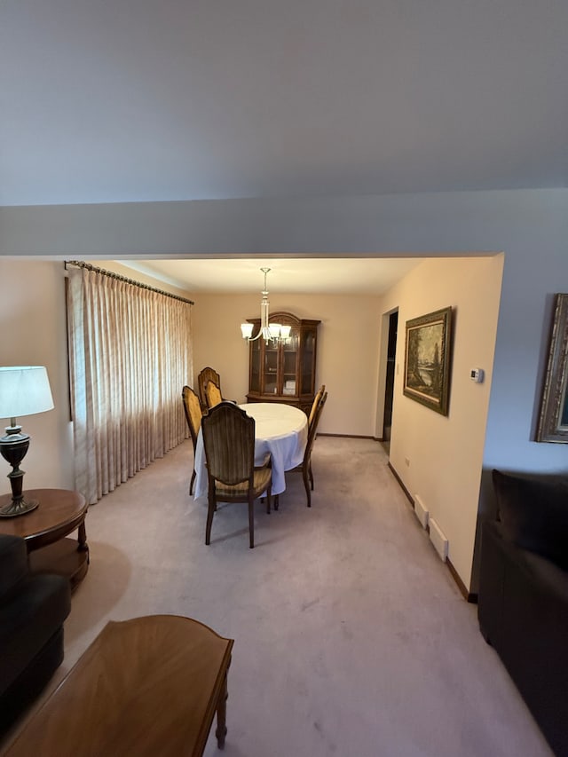 17121 Bernadine St, Lansing, IL 60438 - dining space with a chandelier, light carpet, and baseboards