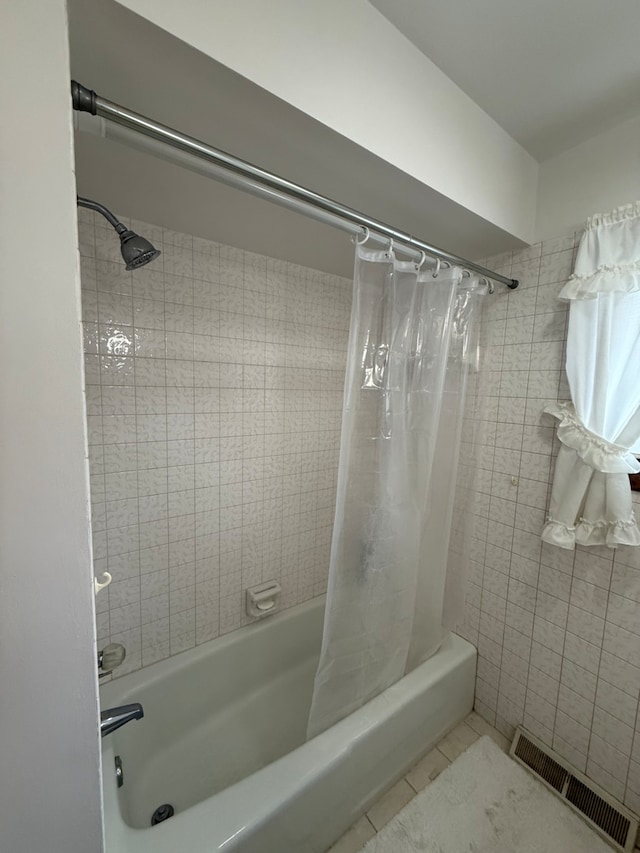 17121 Bernadine St, Lansing, IL 60438 - bathroom with shower / bath combo with shower curtain and tile patterned flooring