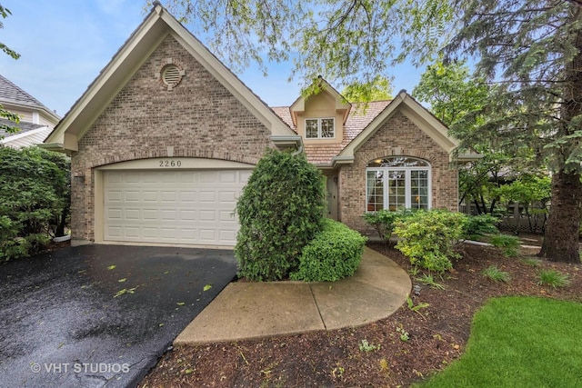 2260 Brookside Ct, Aurora, IL 60502 - traditional-style home with brick siding, driveway, and a garage