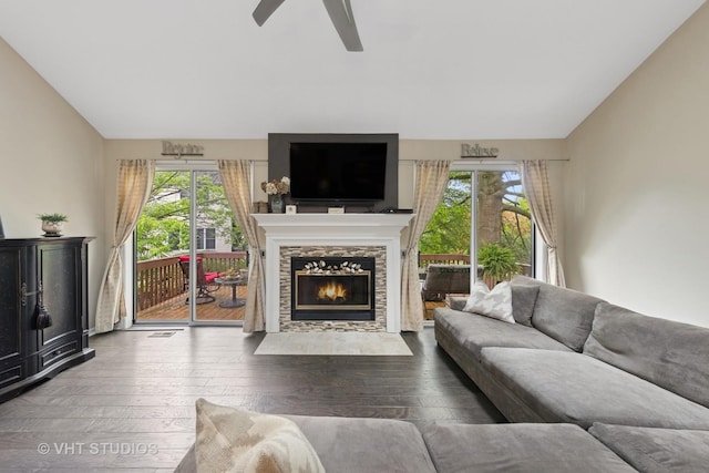 2260 Brookside Ct, Aurora, IL 60502 - living area with lofted ceiling, plenty of natural light, wood-type flooring, a stone fireplace, and ceiling fan