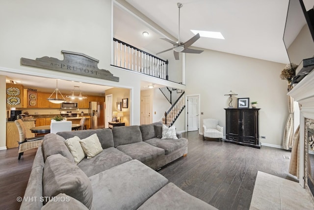 2260 Brookside Ct, Aurora, IL 60502 - living area featuring high vaulted ceiling, dark wood finished floors, ceiling fan, baseboards, and stairs