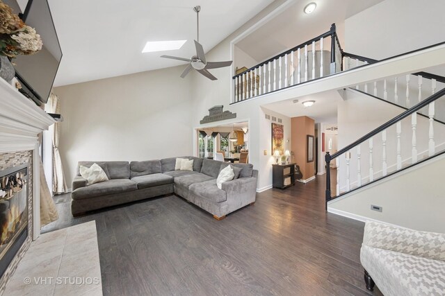 2260 Brookside Ct, Aurora, IL 60502 - living area with a ceiling fan, high vaulted ceiling, stairway, wood finished floors, and a stone fireplace