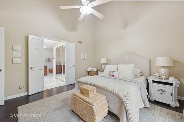 2260 Brookside Ct, Aurora, IL 60502 - bedroom featuring a high ceiling, wood finished floors, baseboards, ensuite bath, and ceiling fan