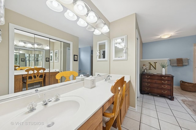 2260 Brookside Ct, Aurora, IL 60502 - bathroom featuring double vanity, tile patterned flooring, and baseboards