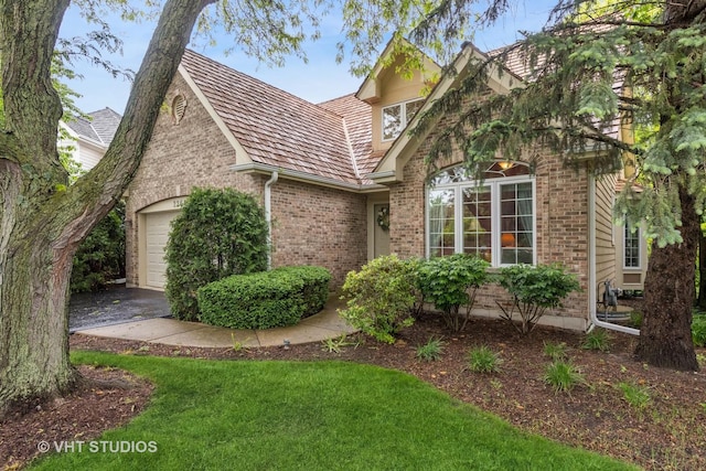2260 Brookside Ct, Aurora, IL 60502 - view of front facade featuring brick siding and a garage