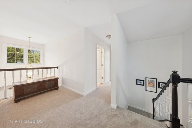 2260 Brookside Ct, Aurora, IL 60502 - corridor with carpet flooring, an upstairs landing, and baseboards