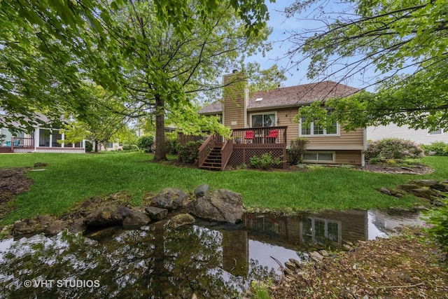 2260 Brookside Ct, Aurora, IL 60502 - rear view of house with a wooden deck, a chimney, a yard, and stairway