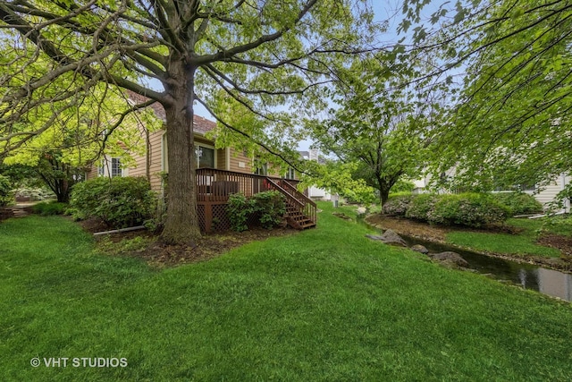 2260 Brookside Ct, Aurora, IL 60502 - view of grassy yard featuring a wooden deck and stairway
