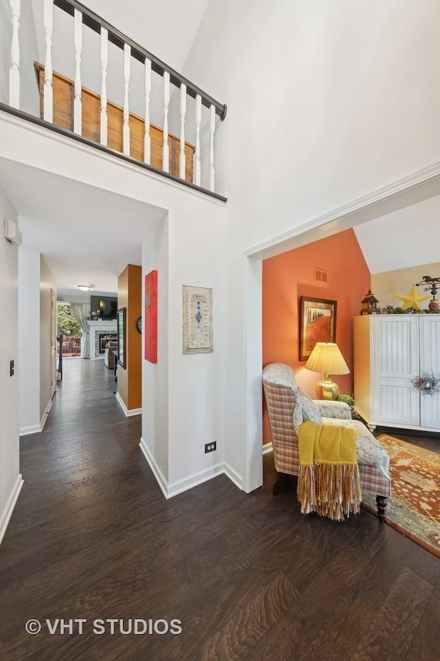 2260 Brookside Ct, Aurora, IL 60502 - hallway with wood finished floors, baseboards, and a high ceiling