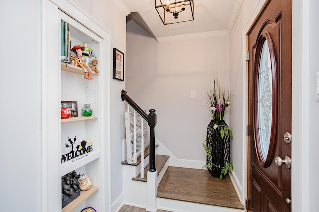 3356 N New England Ave, Chicago, IL 60634 - entrance foyer featuring ornamental molding, a chandelier, baseboards, wood finished floors, and stairs