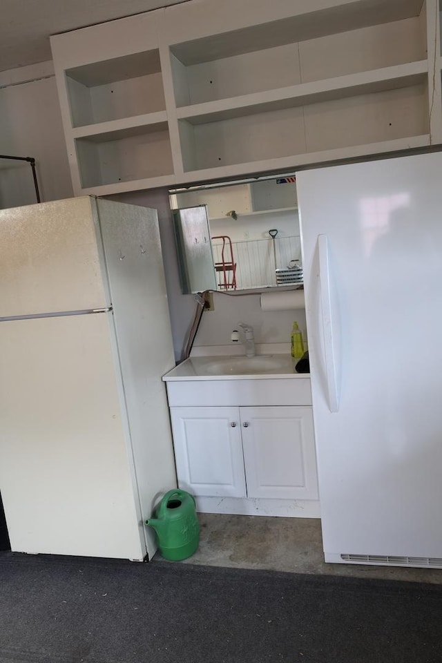 275 Hancock St, Clifton, IL 60927 - kitchen featuring open shelves, freestanding refrigerator, white cabinets, and a sink