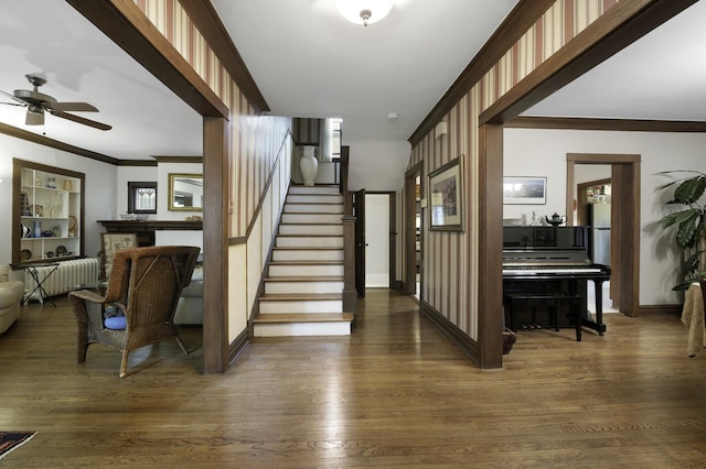 516 Clinton Ave, Oak Park, IL 60304 - foyer featuring a ceiling fan, crown molding, stairway, radiator heating unit, and dark wood-type flooring