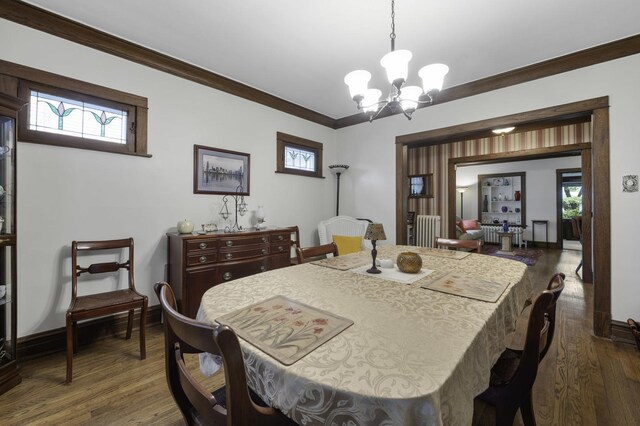 516 Clinton Ave, Oak Park, IL 60304 - dining room featuring dark wood-type flooring, a chandelier, and ornamental molding