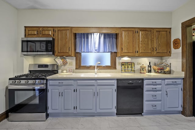 516 Clinton Ave, Oak Park, IL 60304 - kitchen featuring stainless steel appliances, light countertops, decorative backsplash, light marble finish flooring, and brown cabinets