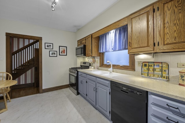 516 Clinton Ave, Oak Park, IL 60304 - kitchen featuring stainless steel appliances, light countertops, backsplash, and brown cabinetry