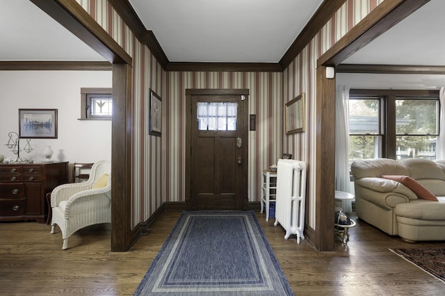 516 Clinton Ave, Oak Park, IL 60304 - entrance foyer featuring radiator heating unit, wallpapered walls, ornamental molding, and wood finished floors