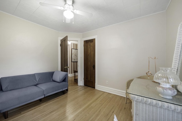 516 Clinton Ave, Oak Park, IL 60304 - living area with light wood-style flooring, crown molding, and ceiling fan