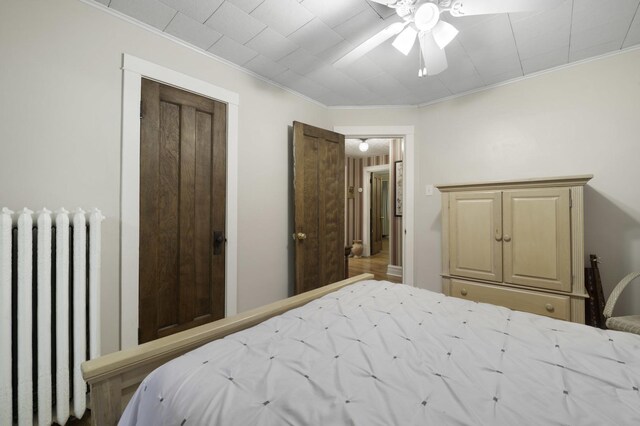 516 Clinton Ave, Oak Park, IL 60304 - bedroom with radiator, ornamental molding, and ceiling fan