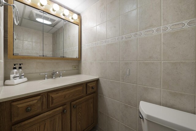 516 Clinton Ave, Oak Park, IL 60304 - bathroom with tile walls, vanity, and backsplash