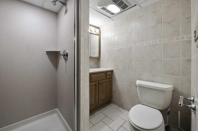 516 Clinton Ave, Oak Park, IL 60304 - full bathroom with vanity, tile patterned flooring, and tile walls