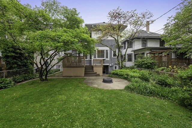 516 Clinton Ave, Oak Park, IL 60304 - back of property featuring stairway, an outdoor fire pit, stucco siding, a chimney, and a deck