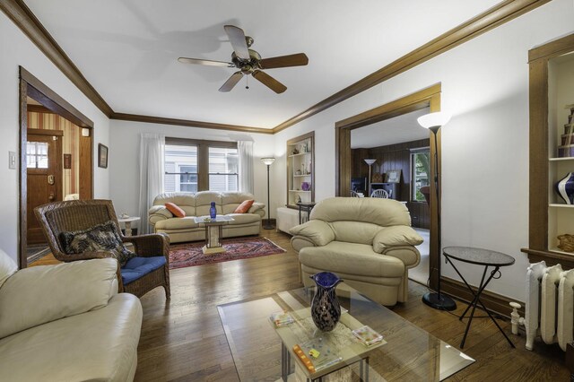 516 Clinton Ave, Oak Park, IL 60304 - living room featuring ceiling fan, wood finished floors, ornamental molding, and healthy amount of natural light