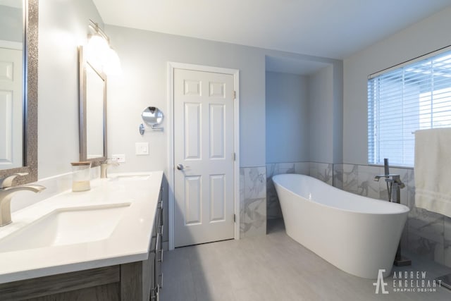 2303 Kentuck Ct, Naperville, IL 60564 - full bath featuring a soaking tub, double vanity, tile walls, and wainscoting
