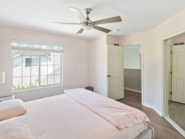 2303 Kentuck Ct, Naperville, IL 60564 - bedroom with baseboards, wood finished floors, and a ceiling fan