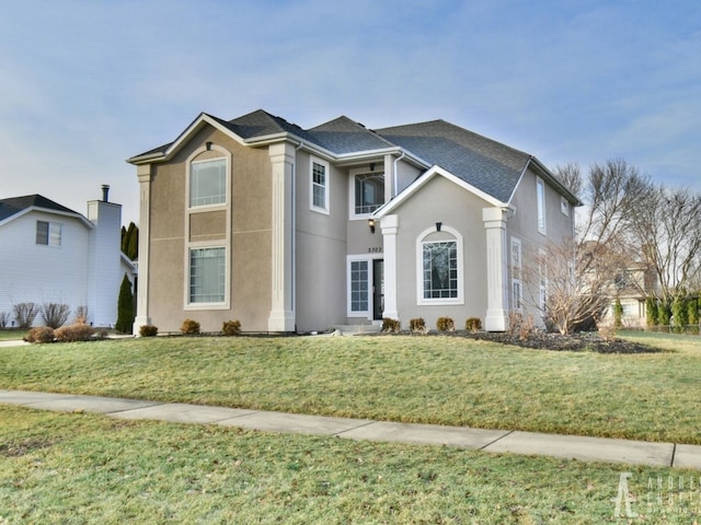 2303 Kentuck Ct, Naperville, IL 60564 - traditional-style house with a front lawn, stucco siding, and a balcony