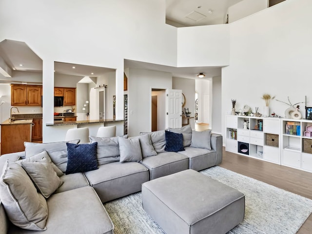 2303 Kentuck Ct, Naperville, IL 60564 - living area with wood finished floors, a high ceiling, and recessed lighting