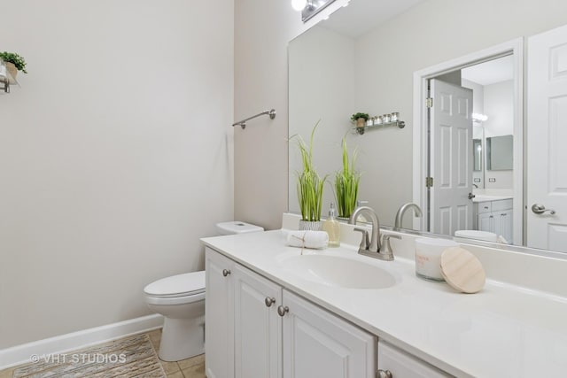66 N Palazzo Dr, Addison, IL 60101 - bathroom with toilet, vanity, tile patterned flooring, and baseboards